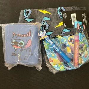 Card/wallet, 2 pair of socks, Pen, Magic Lip gloss, coin purse